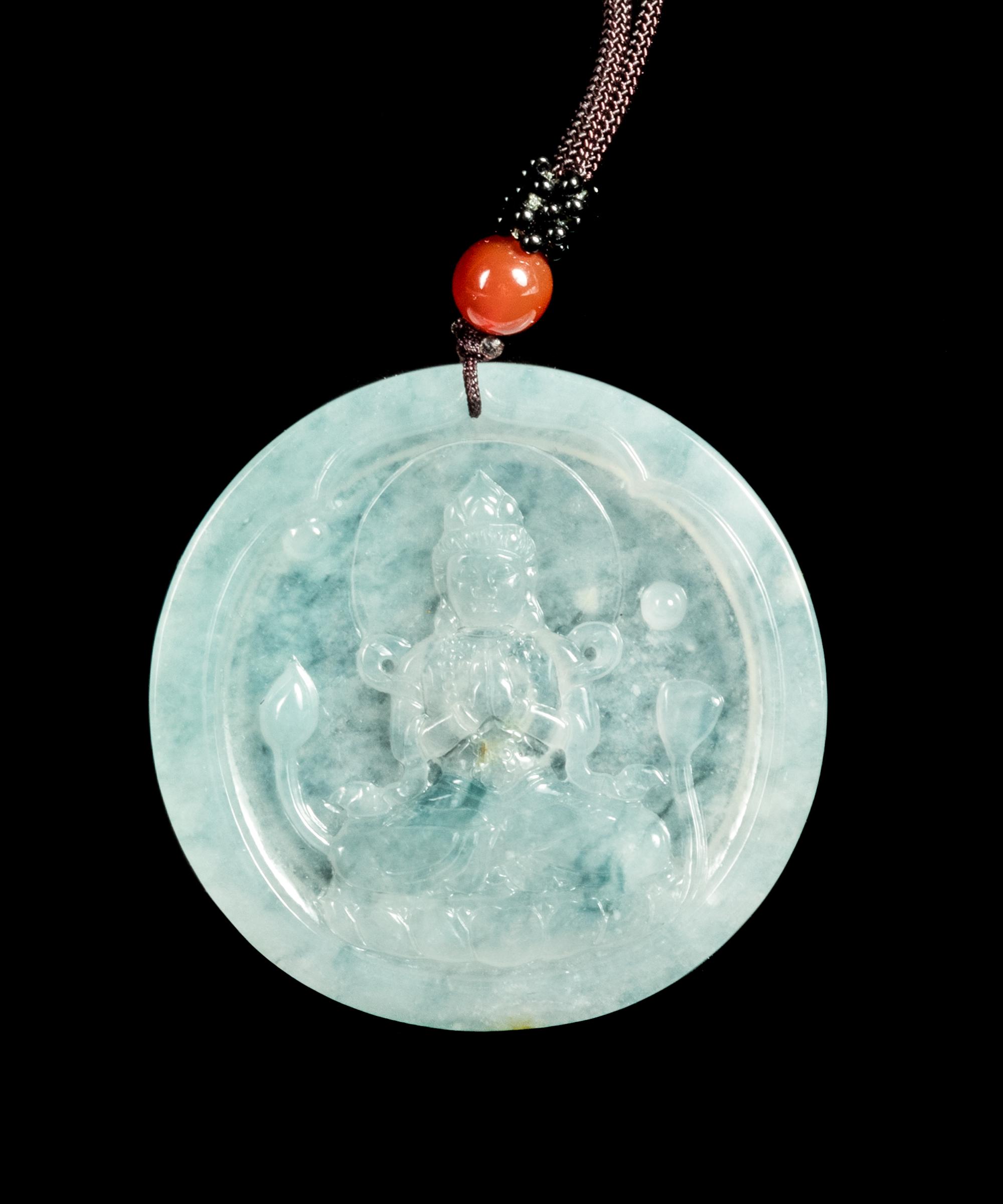 A Jadeite Pendant of Guanyin Diameter 2 1/8 inches. — 20TH CENTURY
