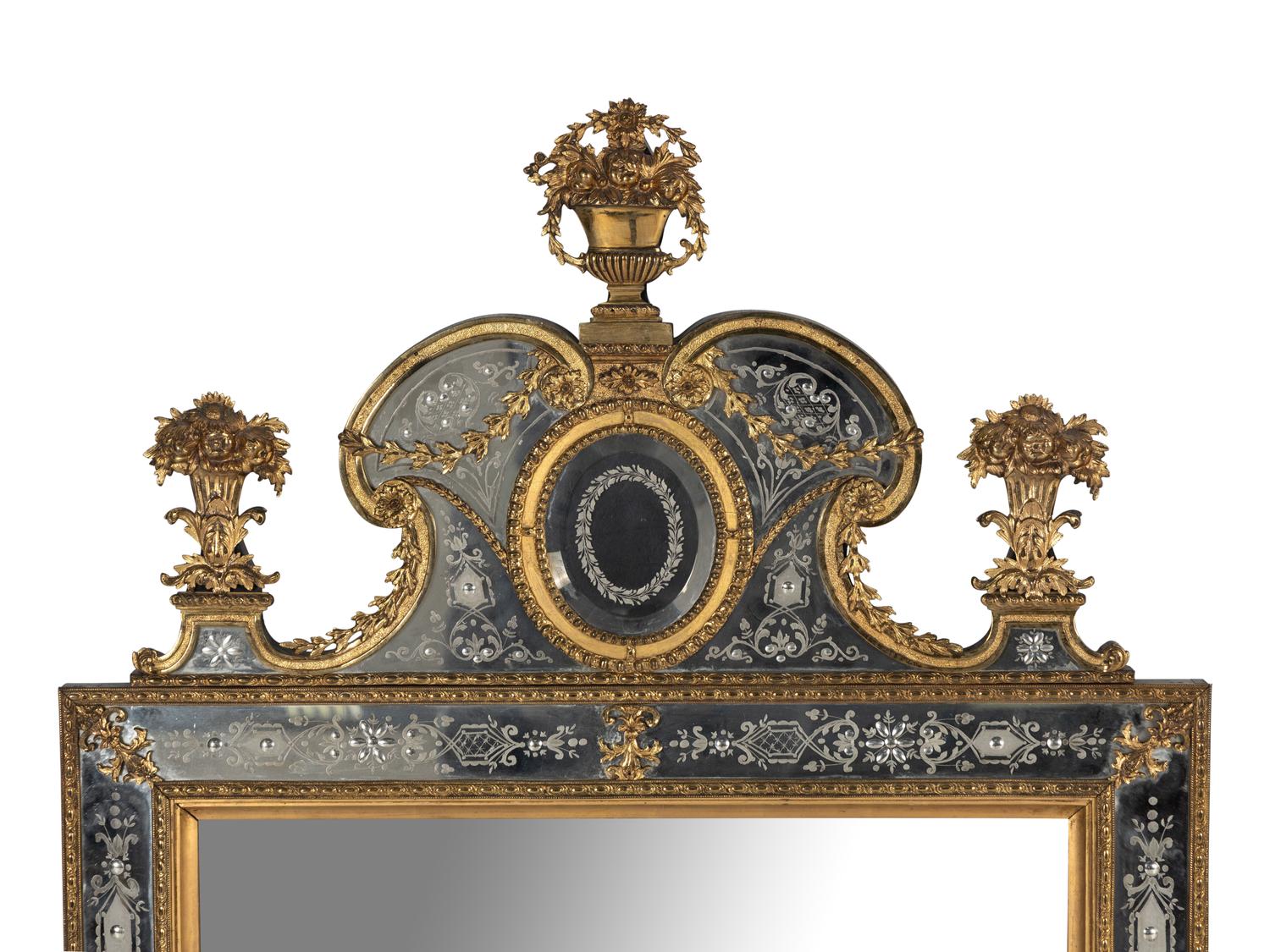 A Pair of Swedish Baroque Style Gilt Metal Mounted Etched Glass Mirrors
