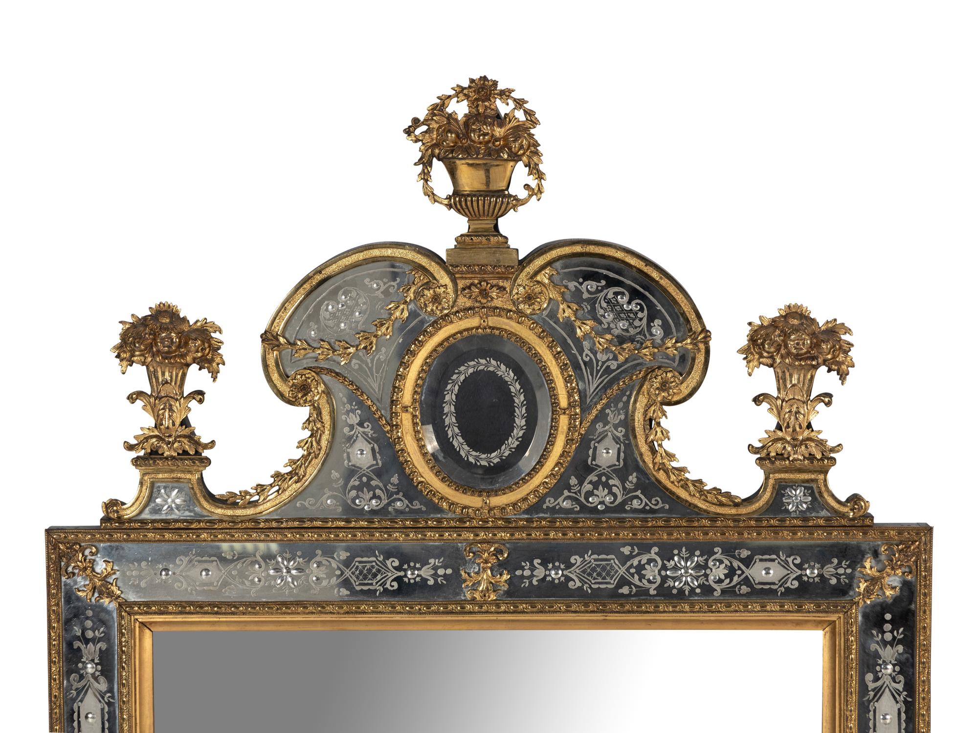 A Pair of Swedish Baroque Style Gilt Metal Mounted Etched Glass Mirrors