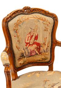 A Pair of Louis XV Tapestry-Upholstered Walnut Fauteuils