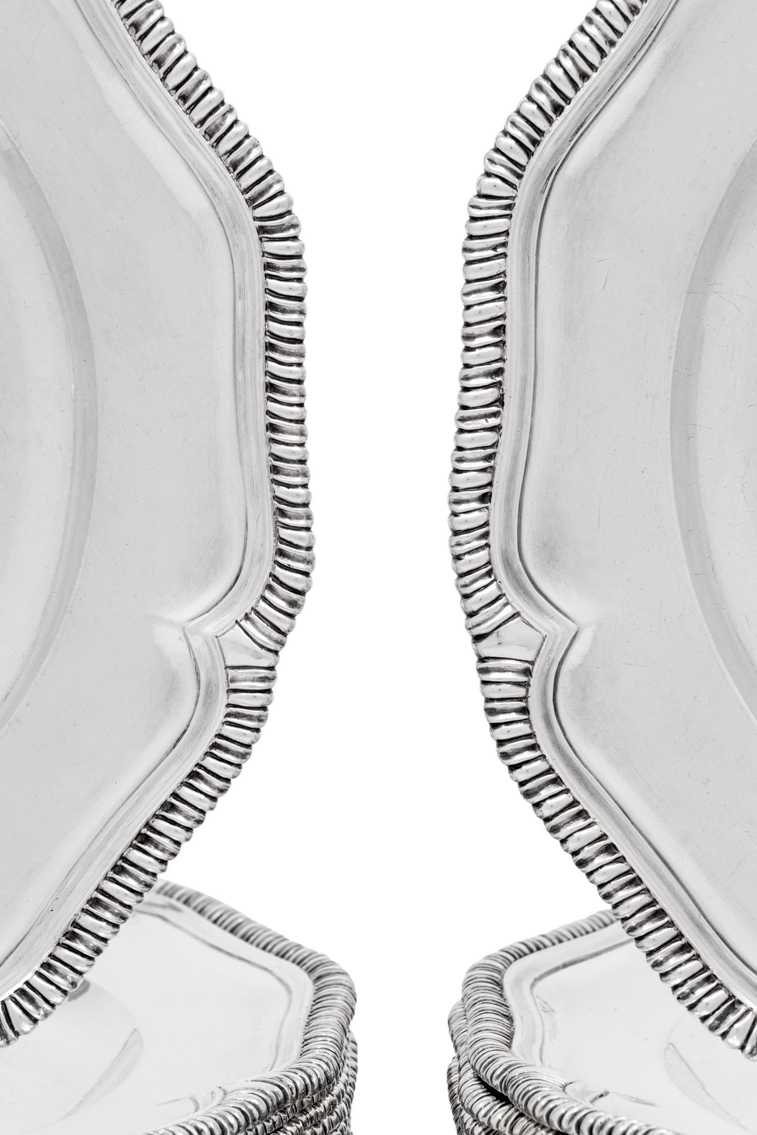Two Sets of Twelve George III Silver Dinner Plates