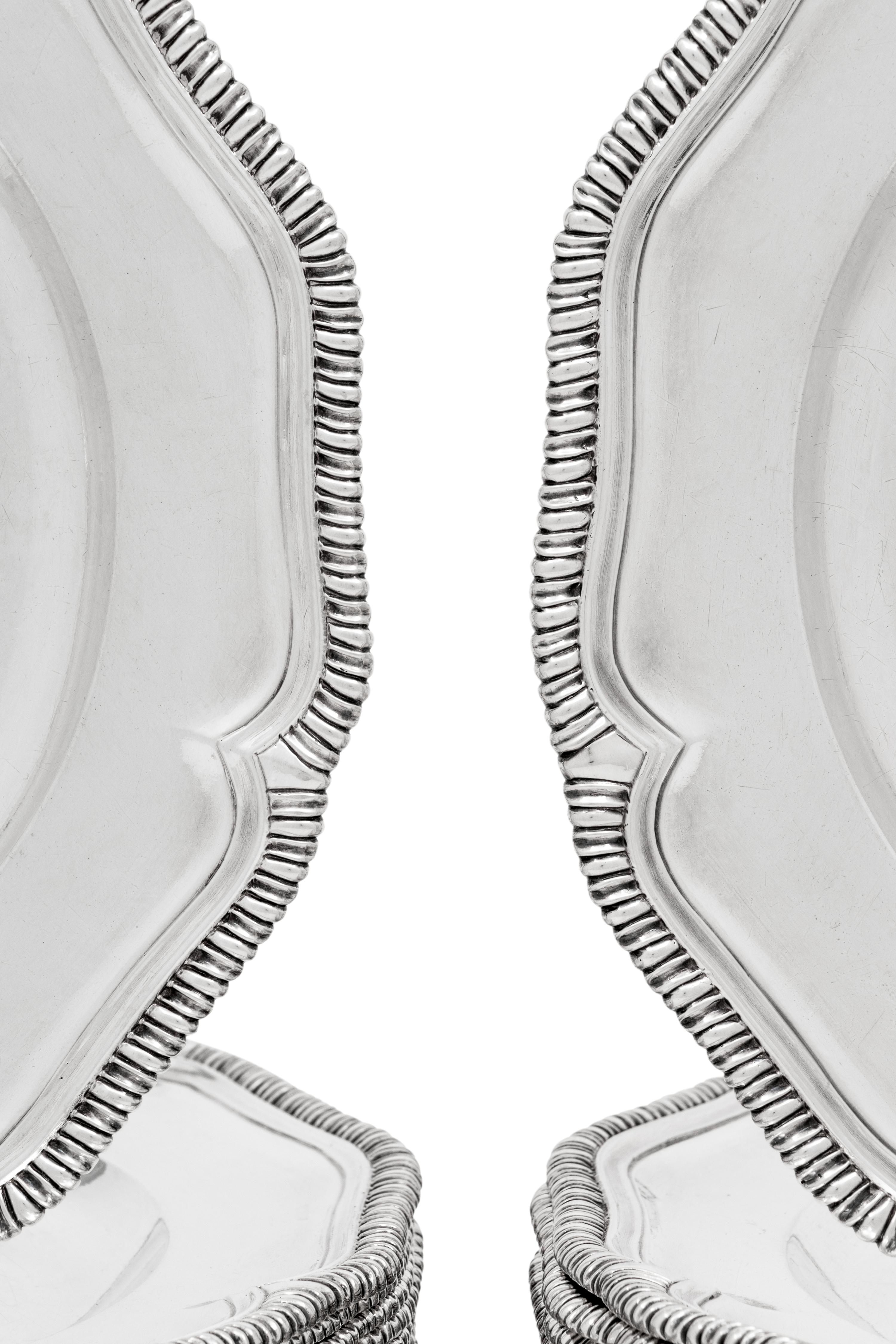 Two Sets of Twelve George III Silver Dinner Plates