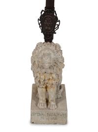 A Cast Stone Seated Lion with Iron Flag Pole in the Manner of Mizner