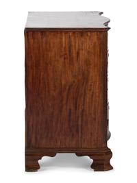 A George III Figured Mahogany Serpentine Front Bachelor's Chest
