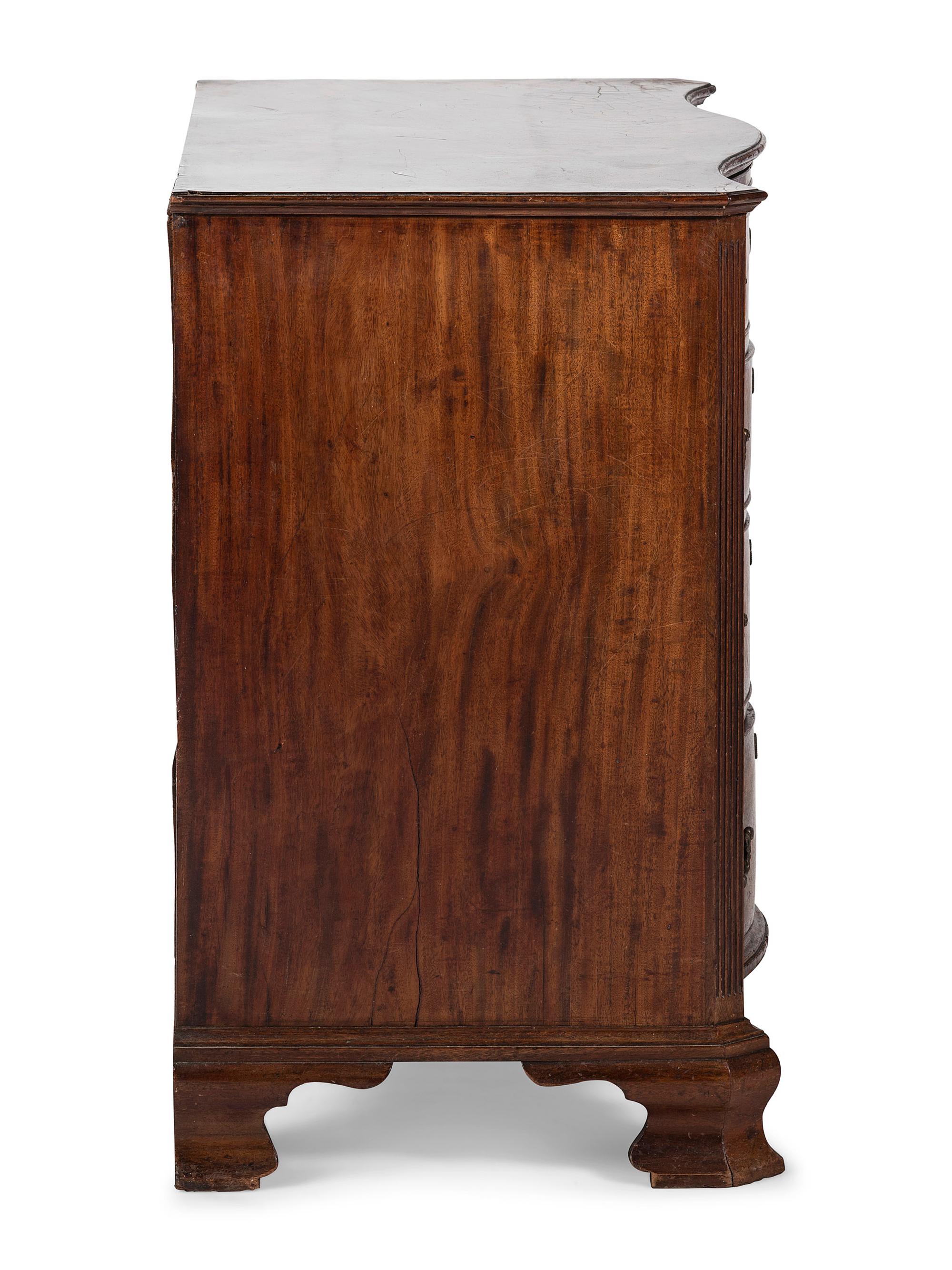 A George III Figured Mahogany Serpentine Front Bachelor's Chest