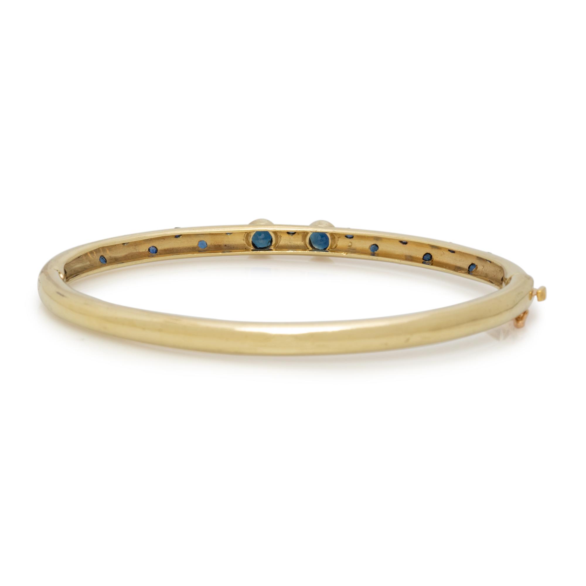 YELLOW GOLD AND SAPPHIRE BANGLE BRACELET