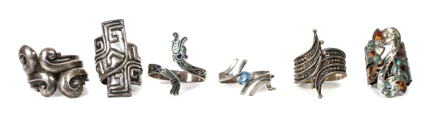Six Mexican Silver Hinged Cuff Bracelets. Length of largest 7 1/4 x width 3 inches.
