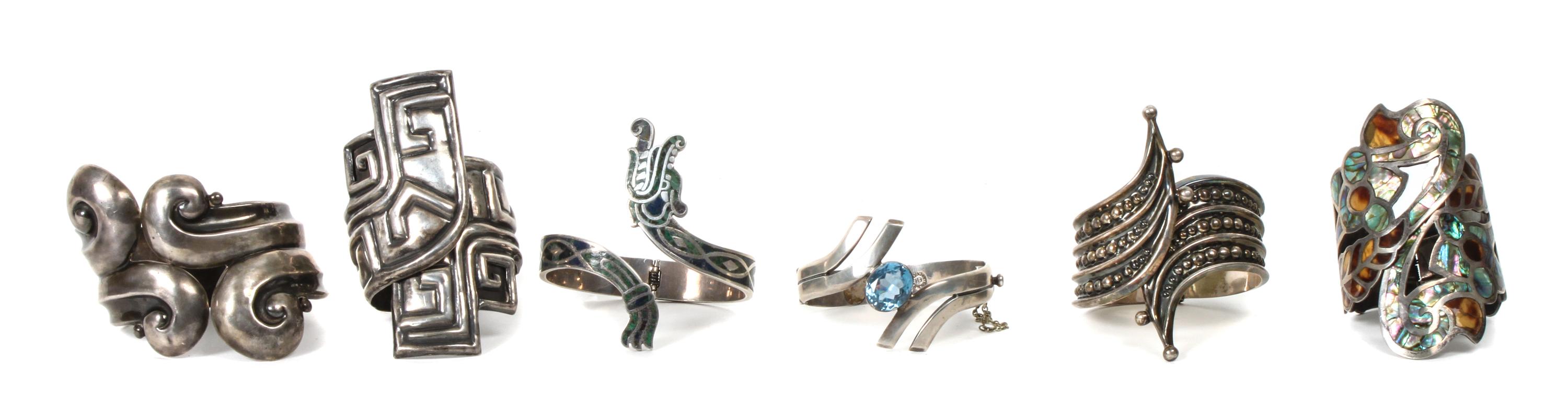 Six Mexican Silver Hinged Cuff Bracelets. Length of largest 7 1/4 x width 3 inches.
