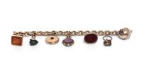 A 14 Karat Yellow Gold Bracelet with Seven Attached Fobs and Charms,