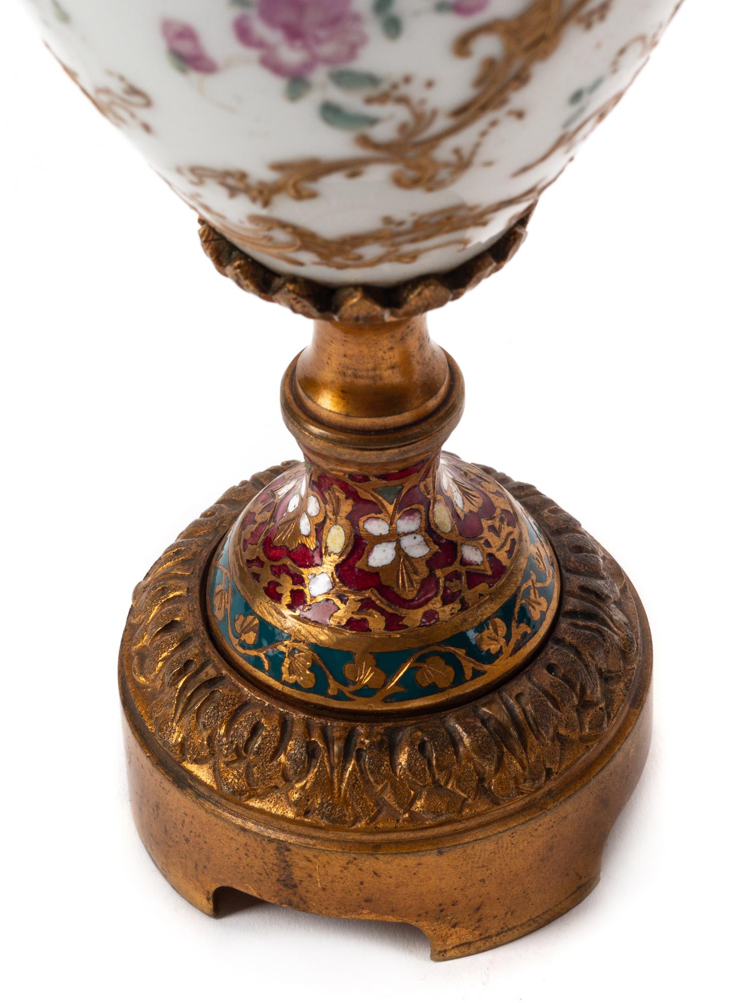 A Pair of French Porcelain, Gilt Bronze and Champlevé Urns