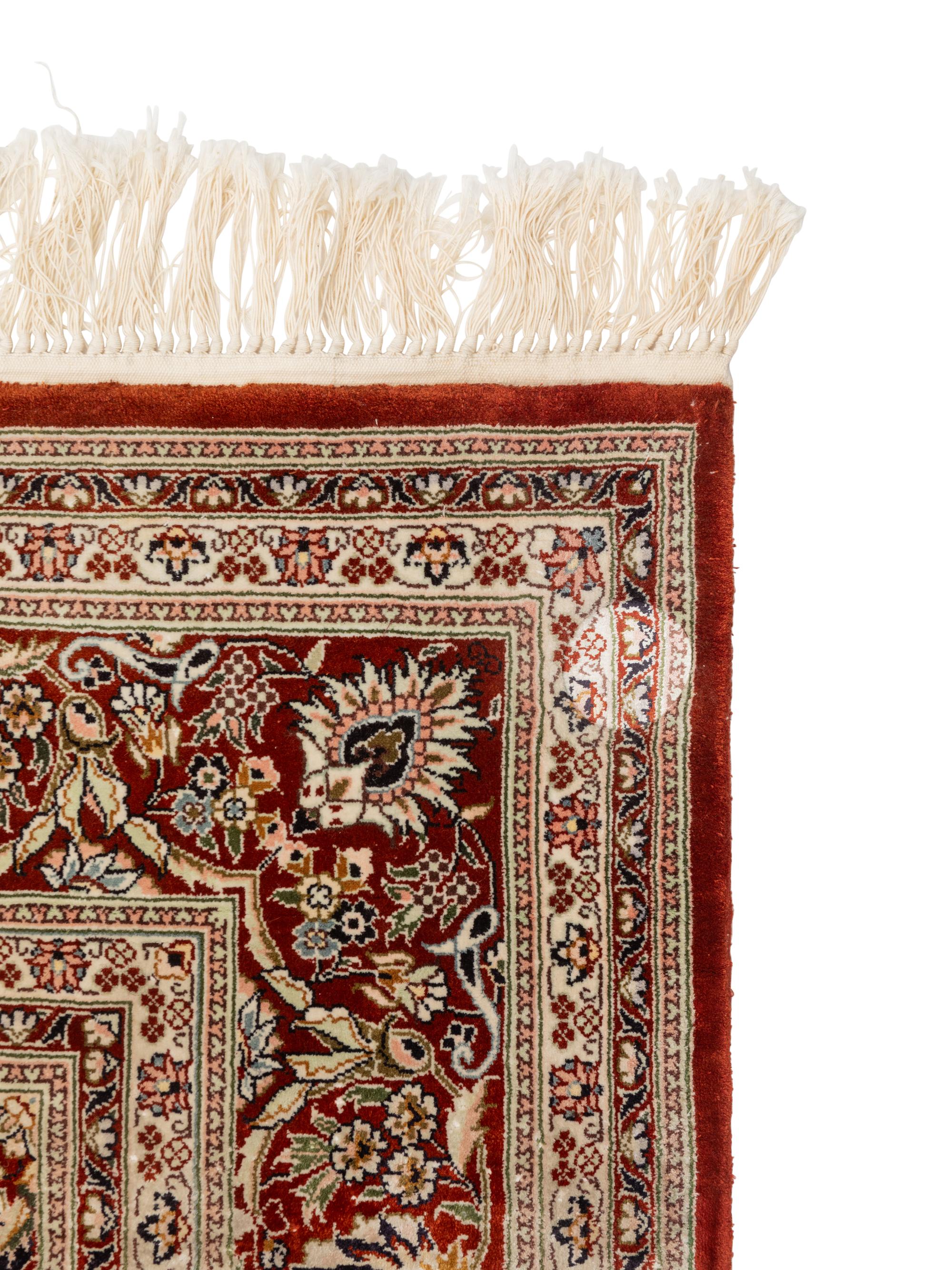 A Silk Tabriz Rug