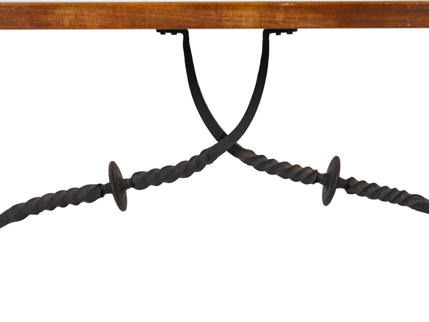 A Spanish Colonial Style Walnut Trestle Table with Wrought Iron Stretcher — 19TH CENTURY