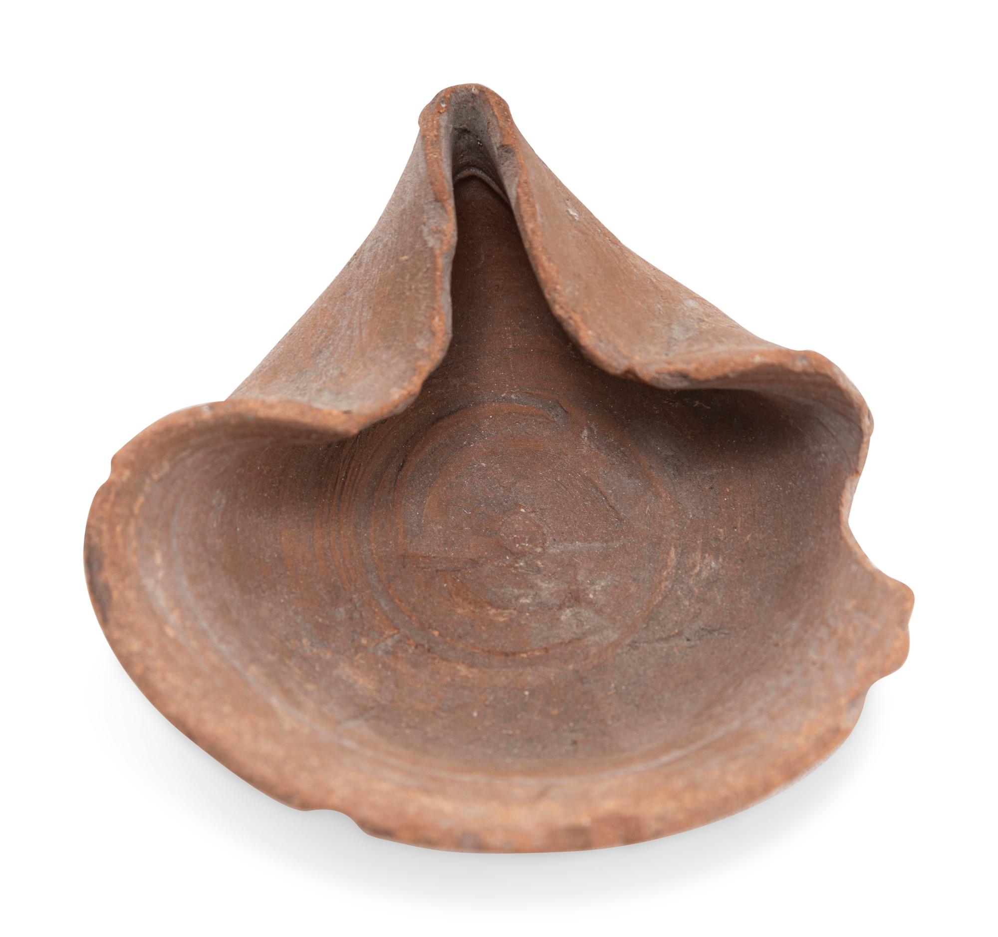 Six 'Shell Type' Terracotta Oil Lamps