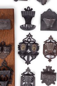 A Group of Cast Iron Hanging Match Holders