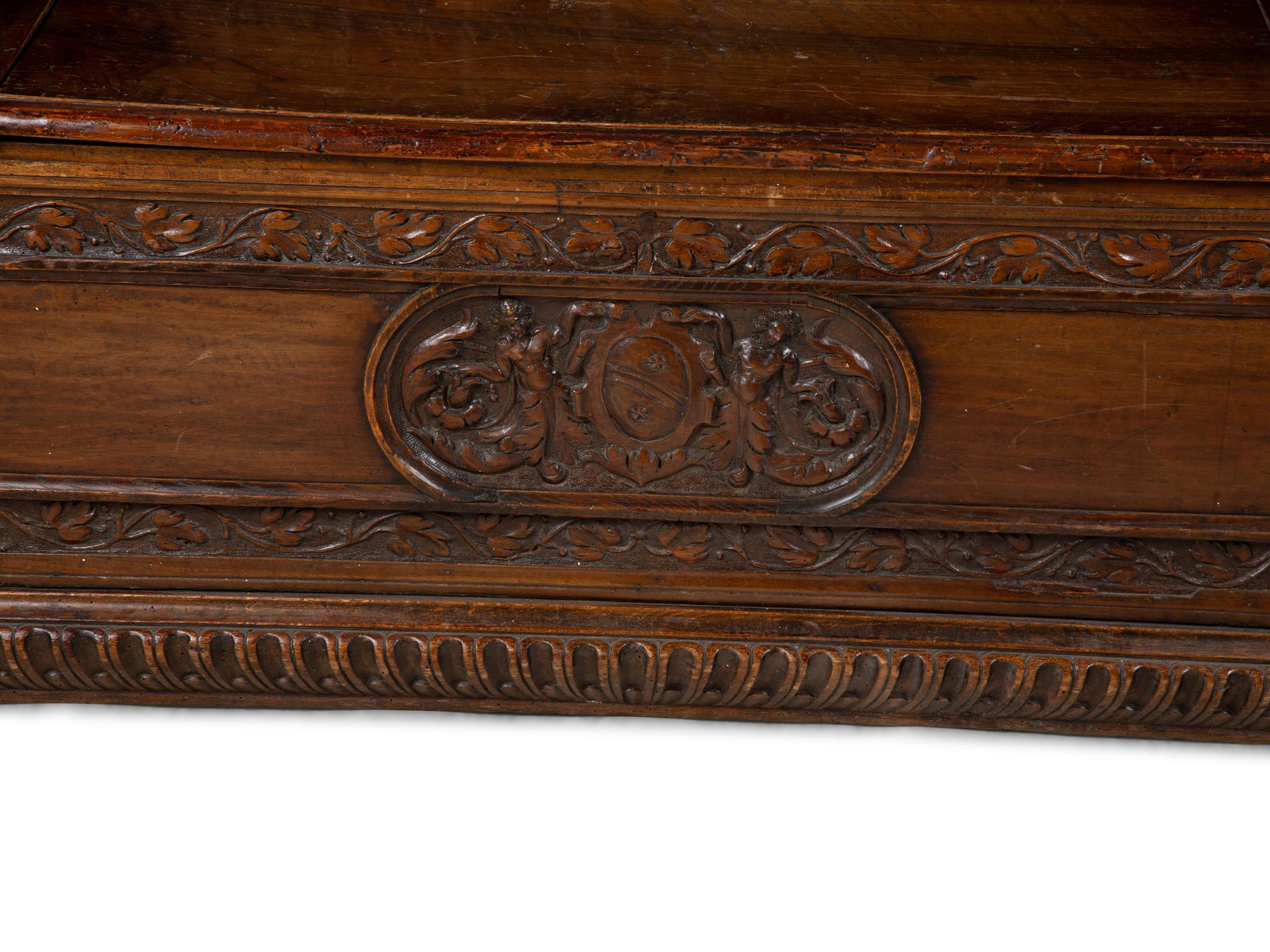 An Italian Carved Walnut Cassapanca — 17/18TH CENTURY AND LATER