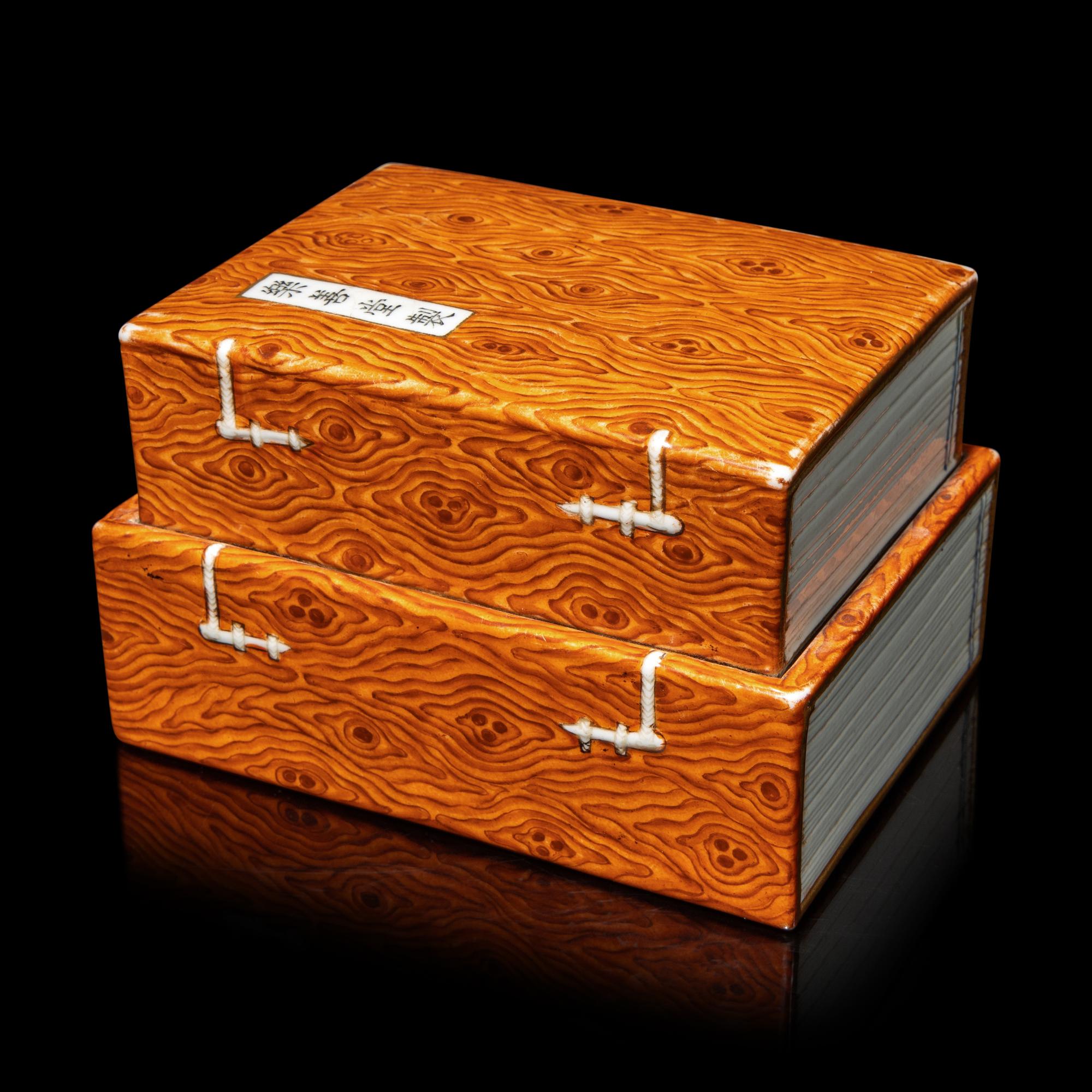 A Chinese Faux Bois Decorated Porcelain 'Books' Box and Cover, Qing Dynasty, 18th-19th Century 清中期 仿木紋釉書式蓋盒