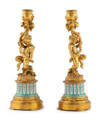 A Pair of French Gilt Bronze and Bourdin Porcelain Figural Candlesticks