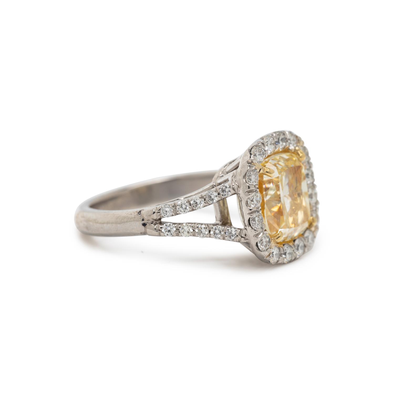 FANCY LIGHT YELLOW DIAMOND AND DIAMOND RING