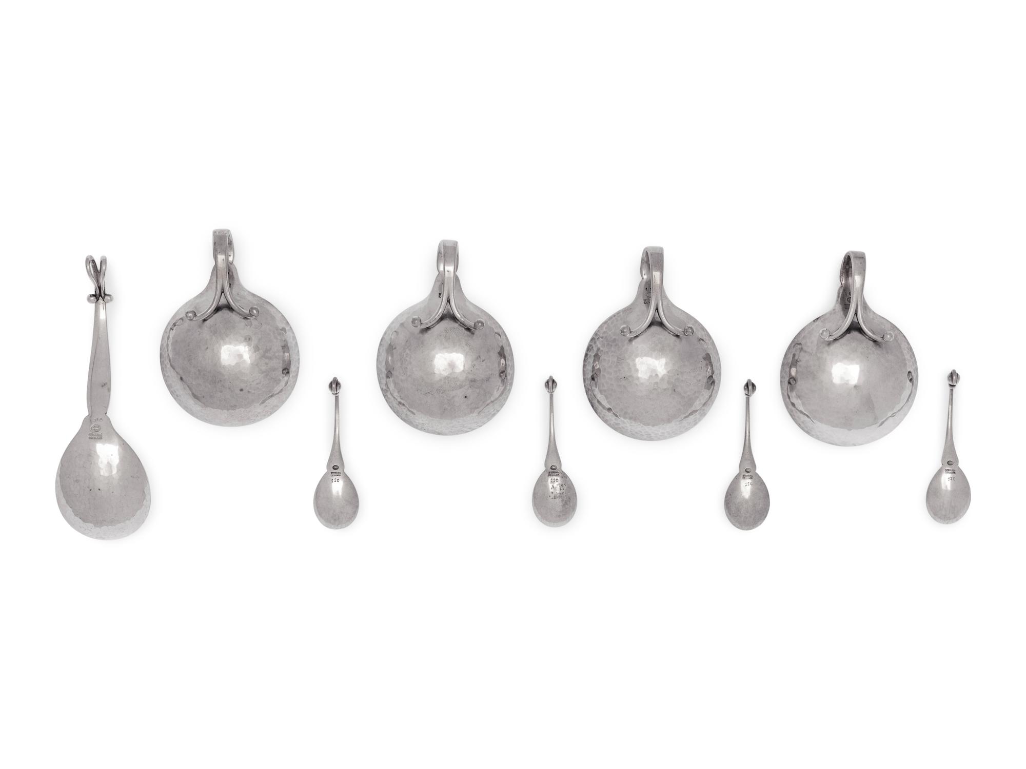 A Set of Four Georg Jensen Silver Salt Cellars and Spoons