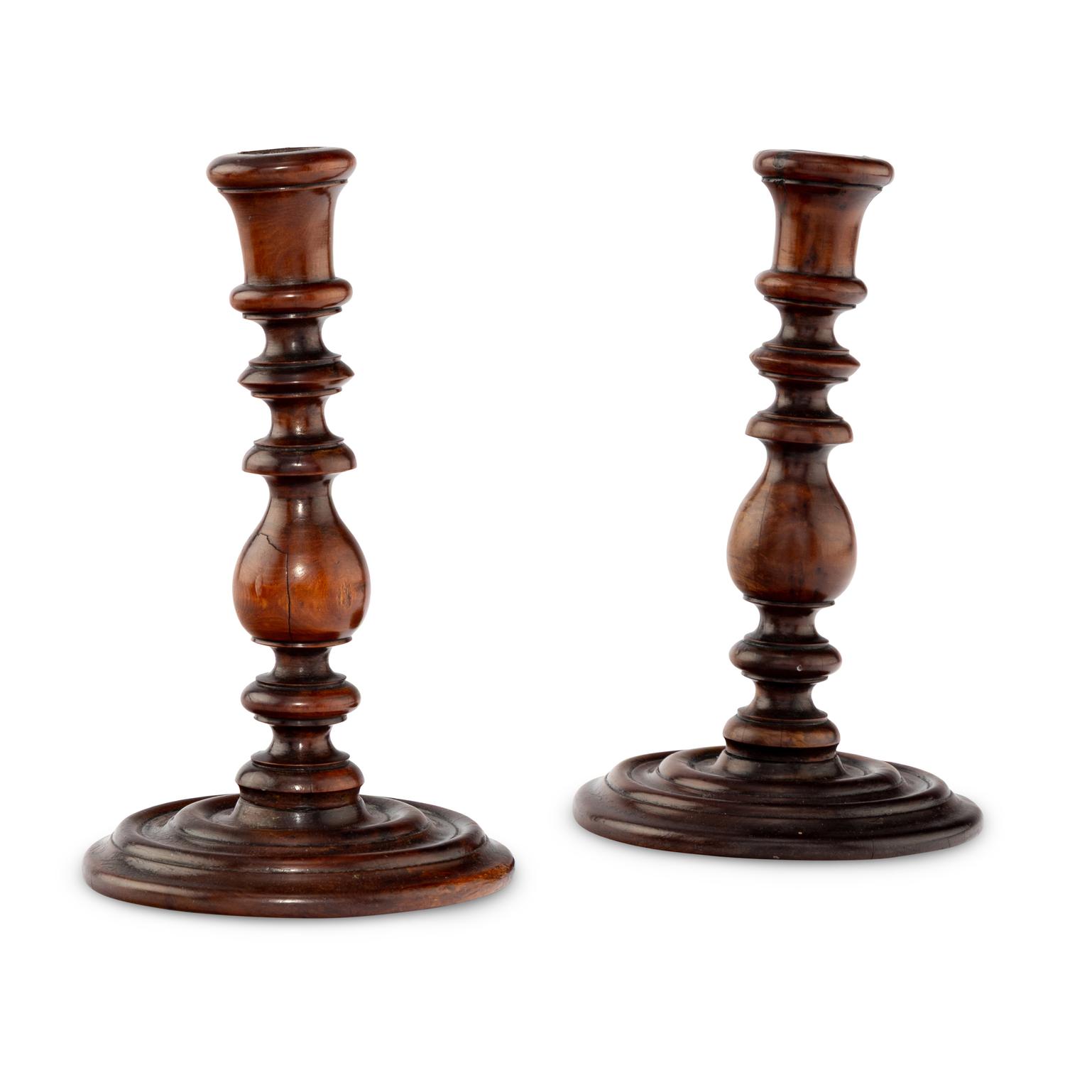 A Pair of English Yew Wood Candlesticks