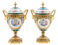 A Pair of Sevres Style Gilt Bronze Mounted Porcelain Urns Height 11 inches. — 19TH/20TH CENTURY