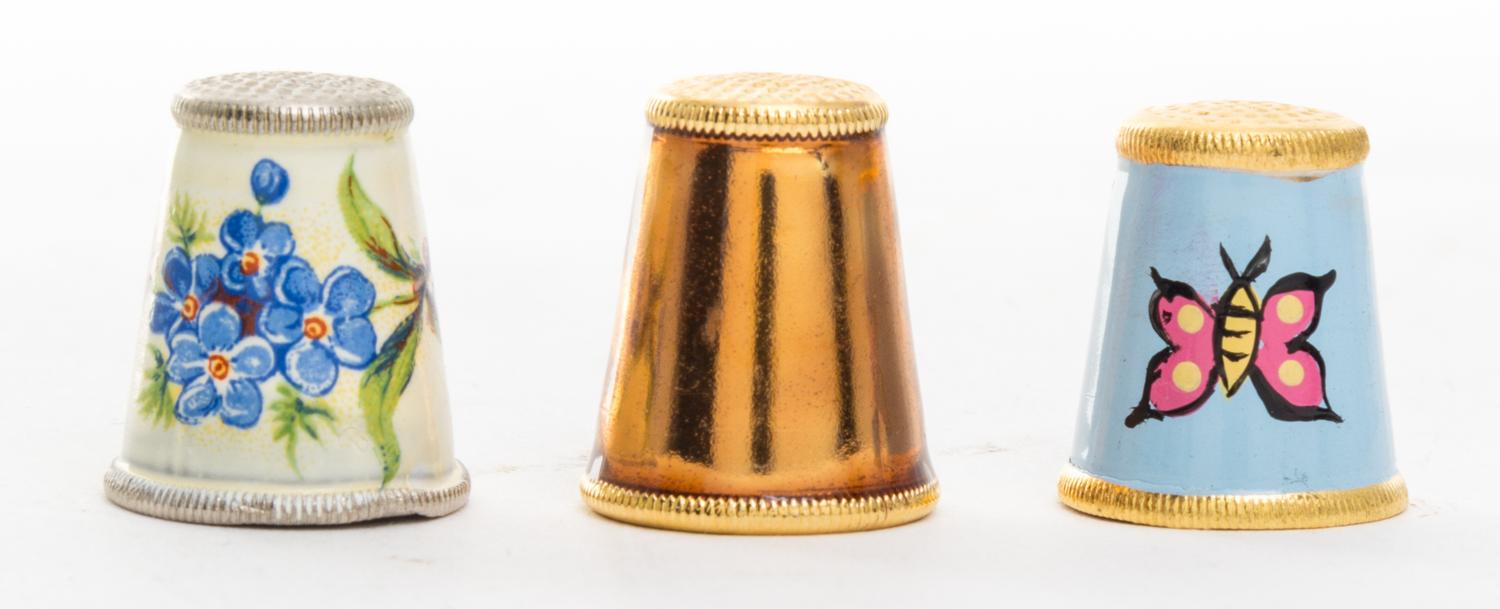 A Collection of Metal Thimbles Height of tallest 3/4 inch.