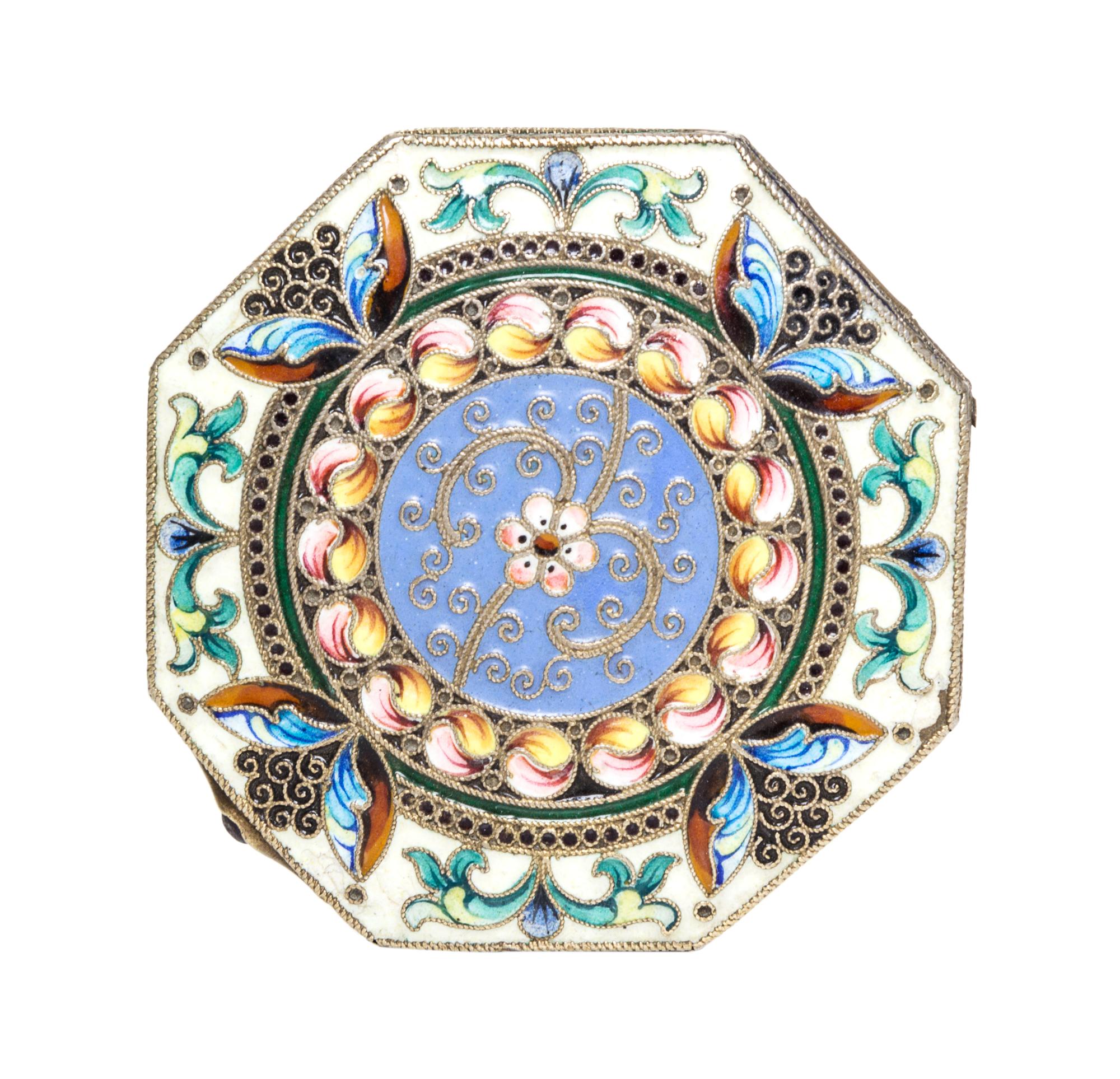A Russian Enameled Gilt-Silver Pill Box, 11th Artel, Moscow, 1908-1926, of octagonal form with polychrome floral decoration.