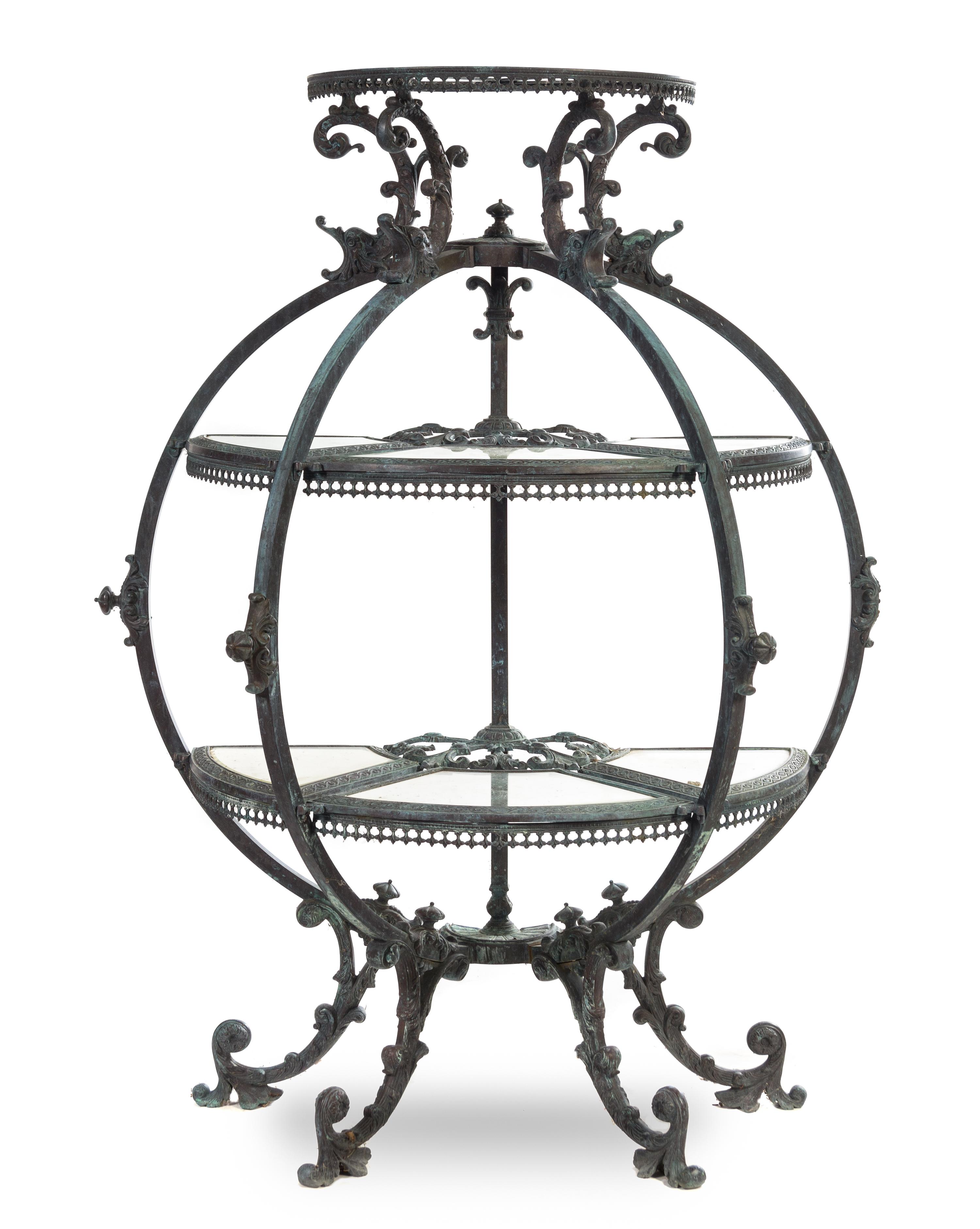 A Neoclassical Cast Metal Garden Etagere Height 53 1/4 x width 40 x depth 17 inches.