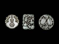 Three Chinese Pale Celadon Jade Reticulated Pendants
