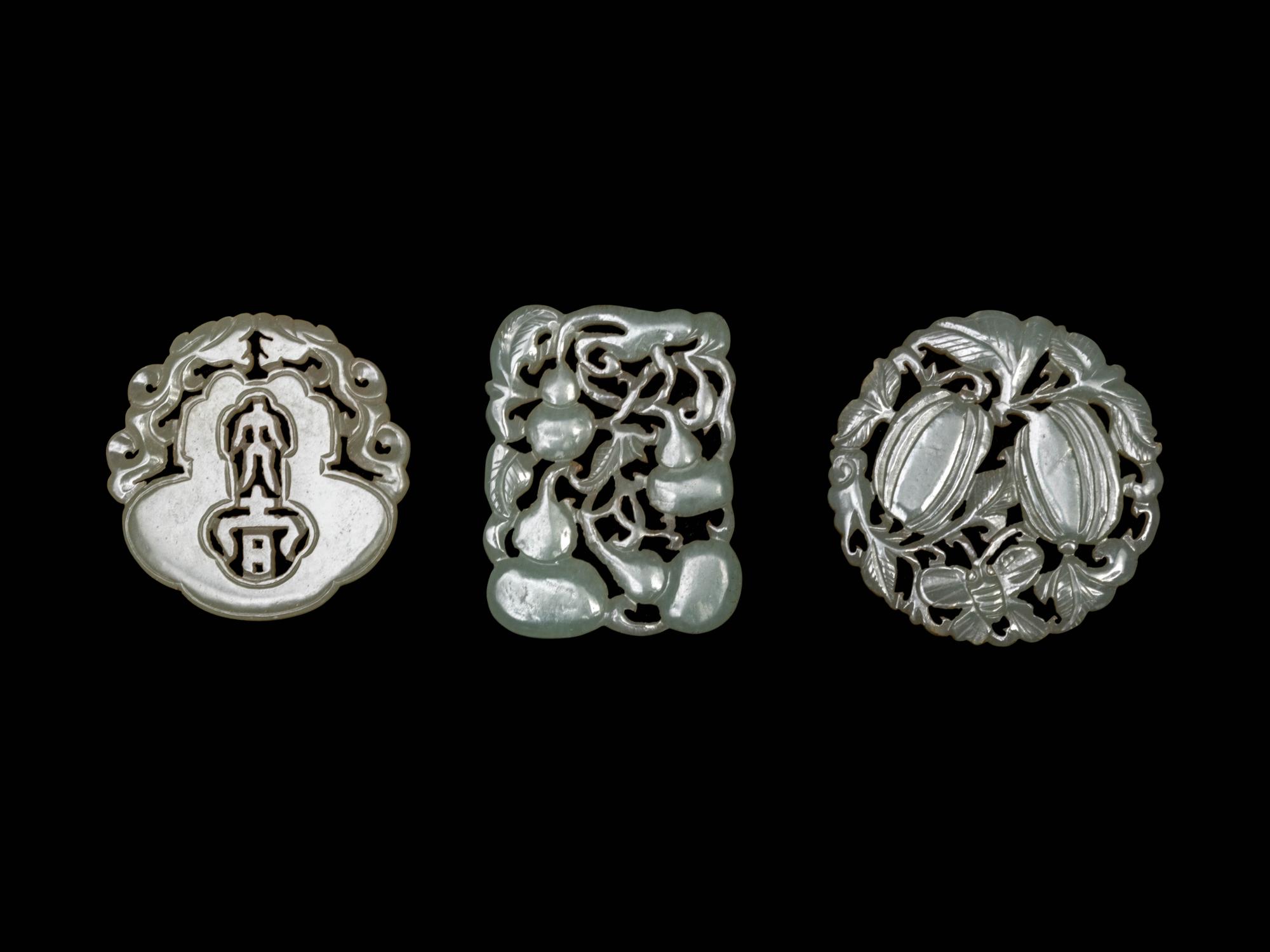 Three Chinese Pale Celadon Jade Reticulated Pendants