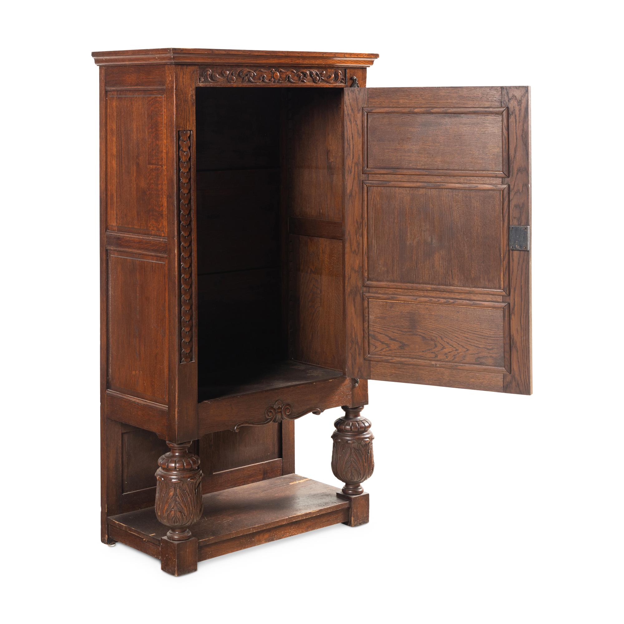 A Baroque Style Carved Oak Cabinet