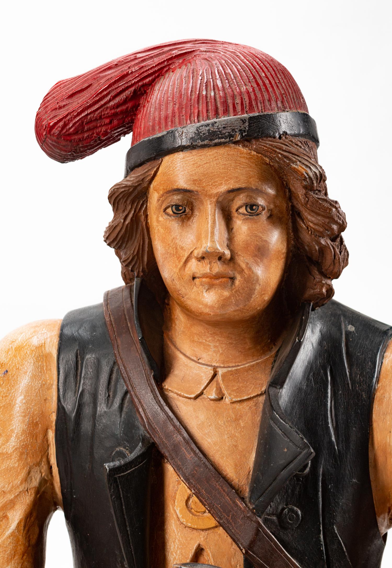 A Dutch Carved and Polychromed Figure of a Man Astride a Wine Barrel
