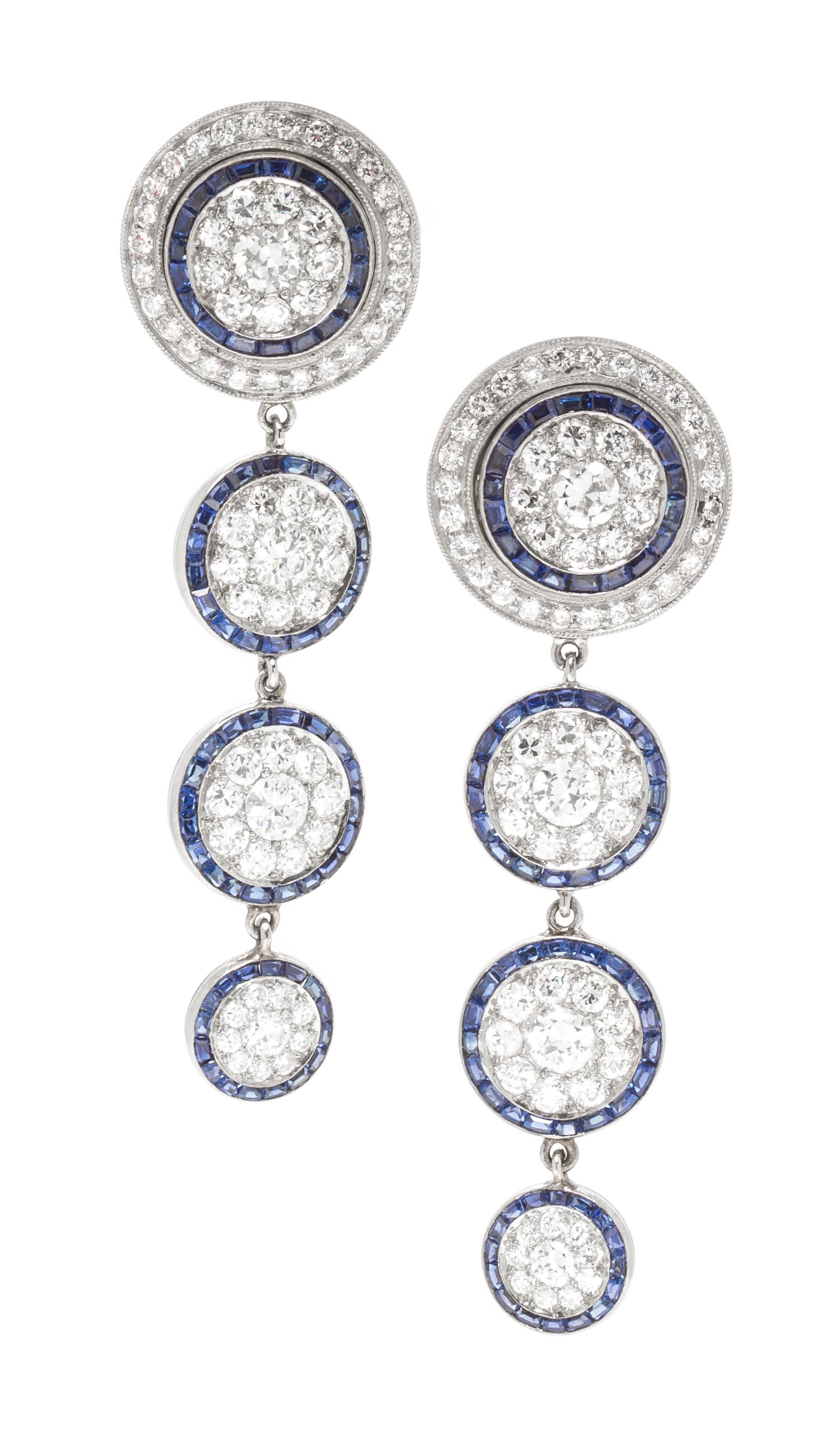 A Pair of Platinum, White Gold, Diamond and Sapphire Earclips, 15.00 dwts.