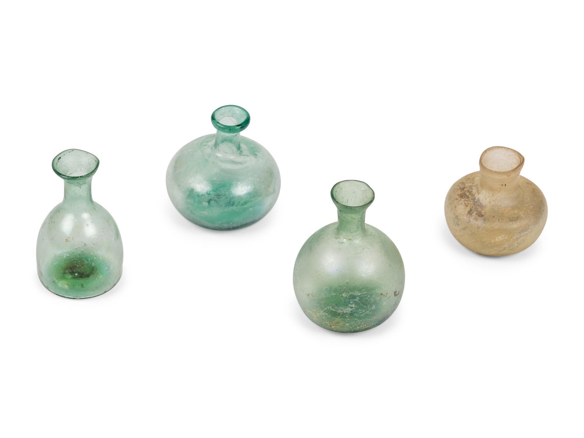 A Group of Four Roman and Islamic Glass Vessels