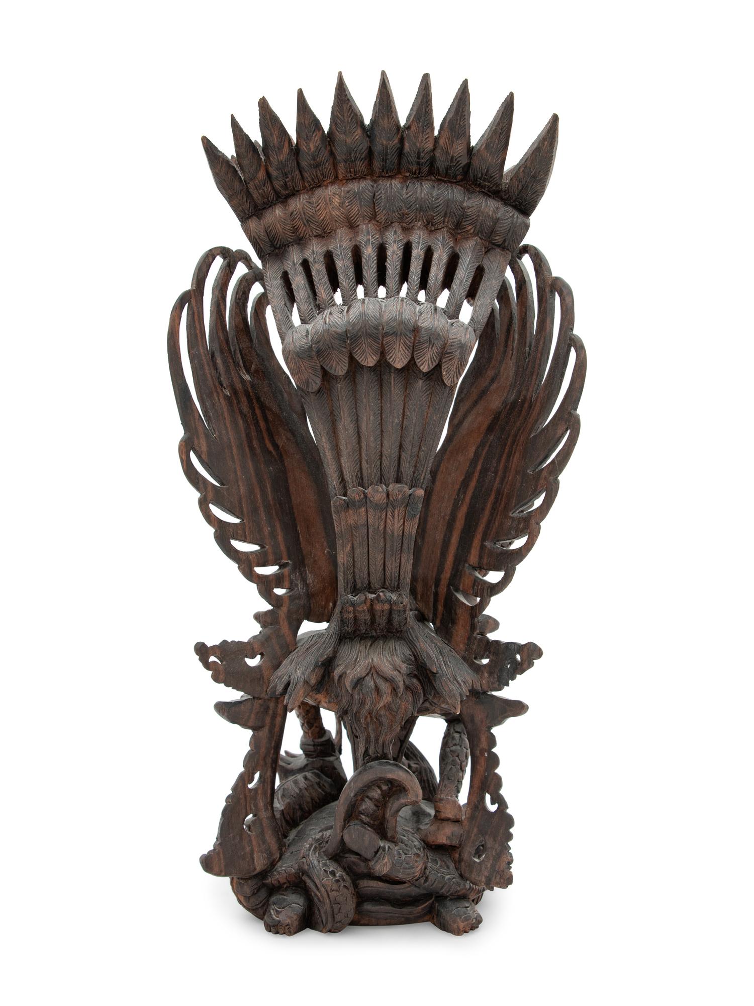 A Thai Carved Wood Figural Group of a Deity and Animals