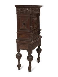 A Pair of Continental Carved Oak Cabinets on Stands