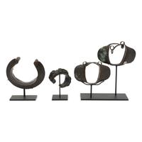 Four African Bronze Adornments on Fitted Stands