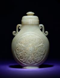 A Rare and Finely Carved Chinese White Jade Covered Vase