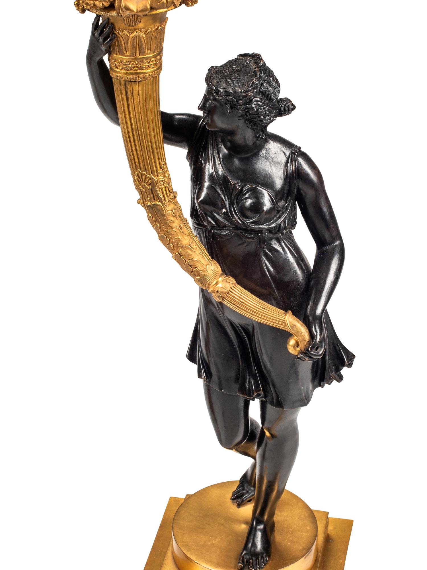 A Pair of Restauration Gilt and Patinated Bronze Figural Ten-Light Candelabra
