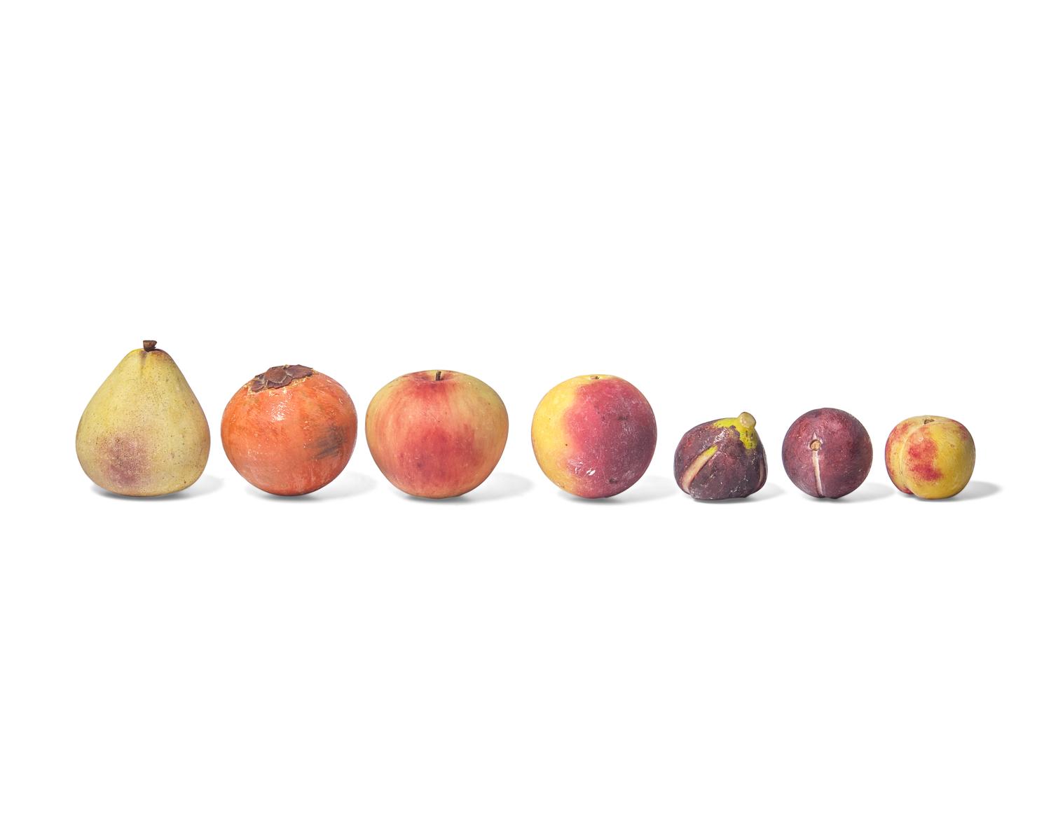 A Collection of Fourteen Carved and Painted Stone fruit