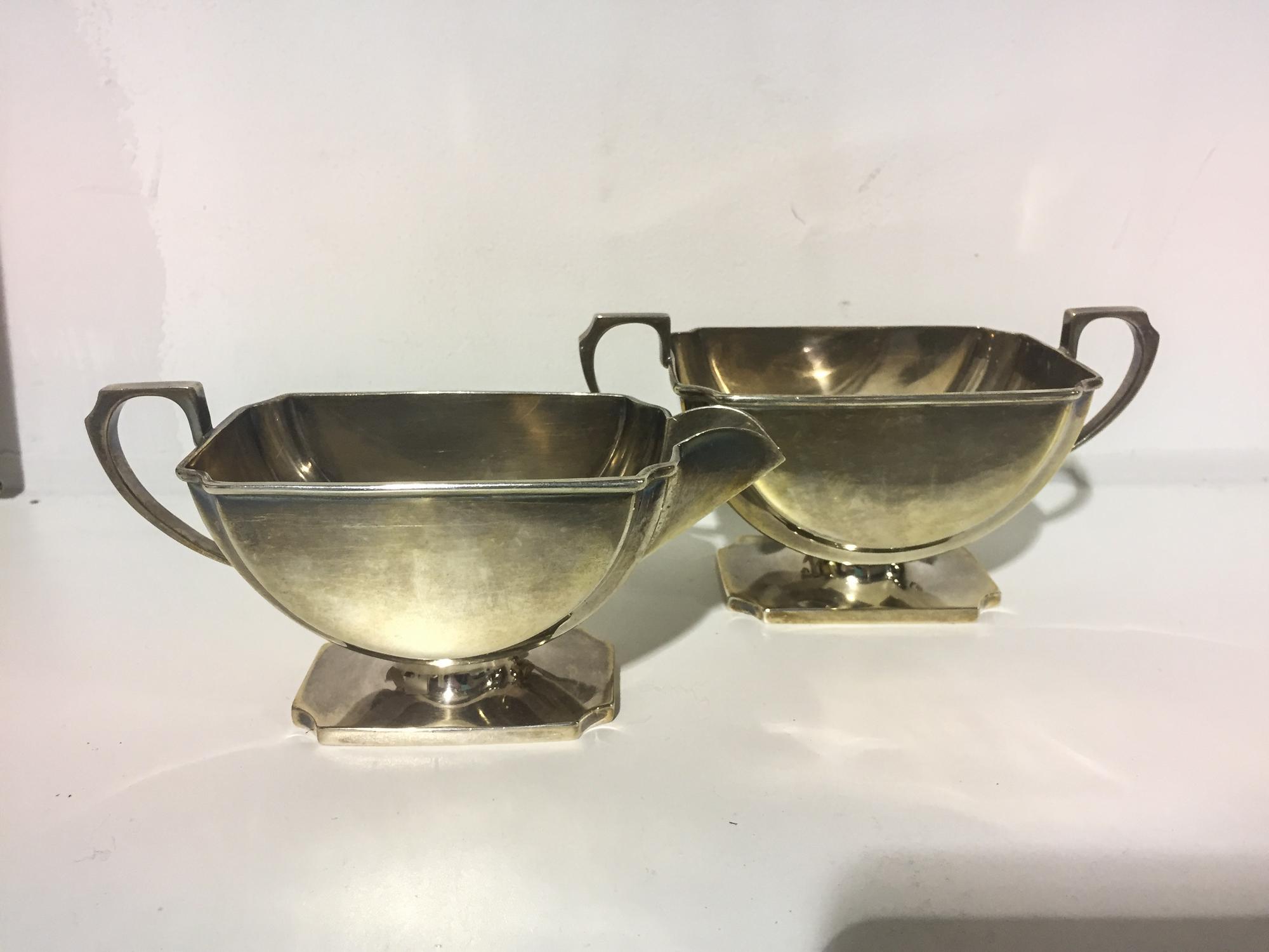 A Victorian Silver Creamer & Sugar Set, Retailed by I.S. Greenberg & Co., Birmingham, 1859, both raised on rectangular feet with canted