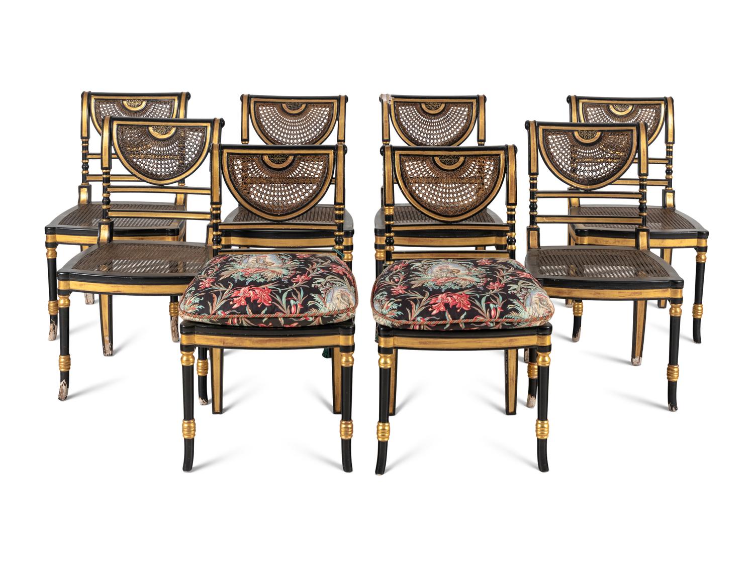 A Set of Eight Regency Style Black Painted and Parcel Gilt Dining Chairs