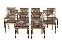 A Set of Eight Regency Style Black Painted and Parcel Gilt Dining Chairs