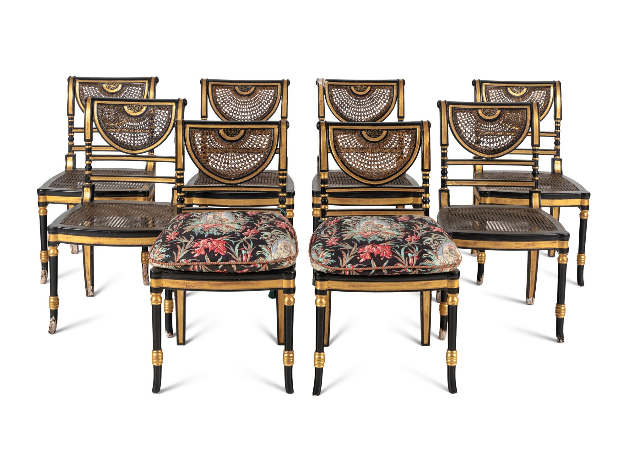 A Set of Eight Regency Style Black Painted and Parcel Gilt Dining Chairs