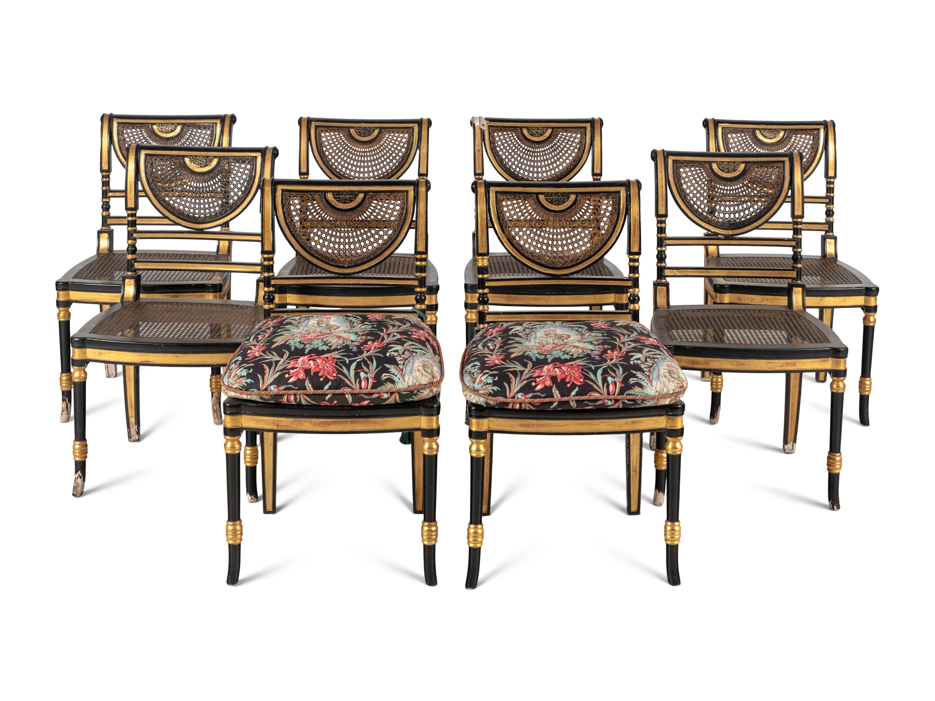 A Set of Eight Regency Style Black Painted and Parcel Gilt Dining Chairs