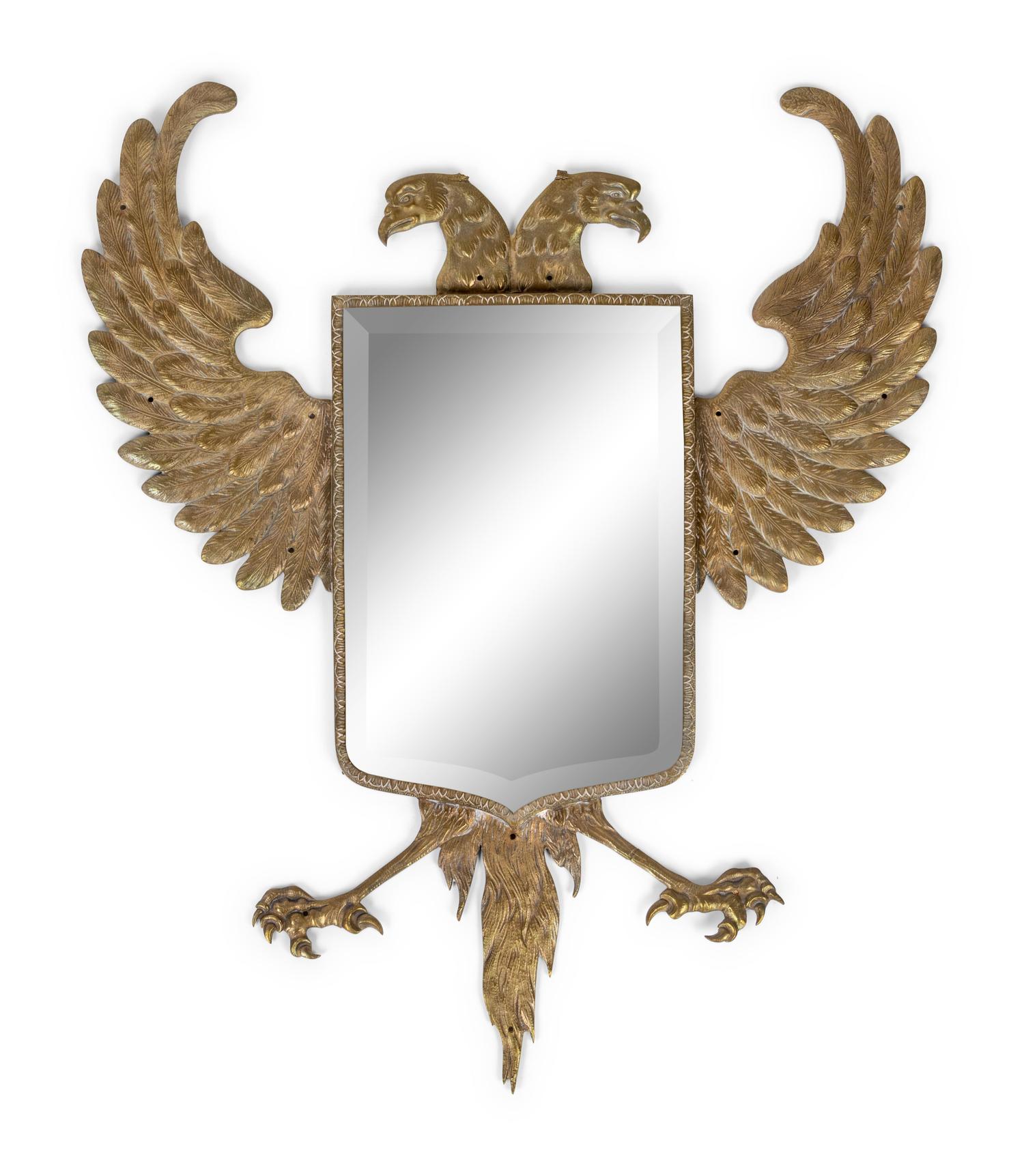 A Continental Pressed Brass Mirror