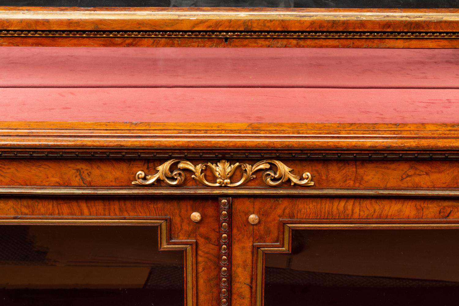 A Napoleon III Parcel Gilt Burlwood Lift-Top Vitrine Cabinet