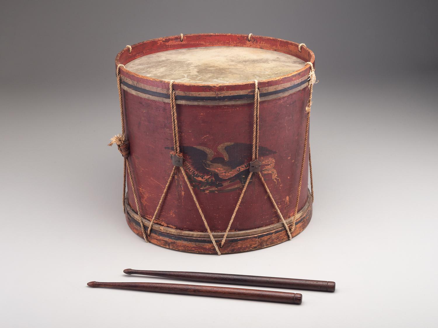 [CIVIL WAR]. E Pluribus Unum red-painted drum featuring eagle motif, with drumsticks.