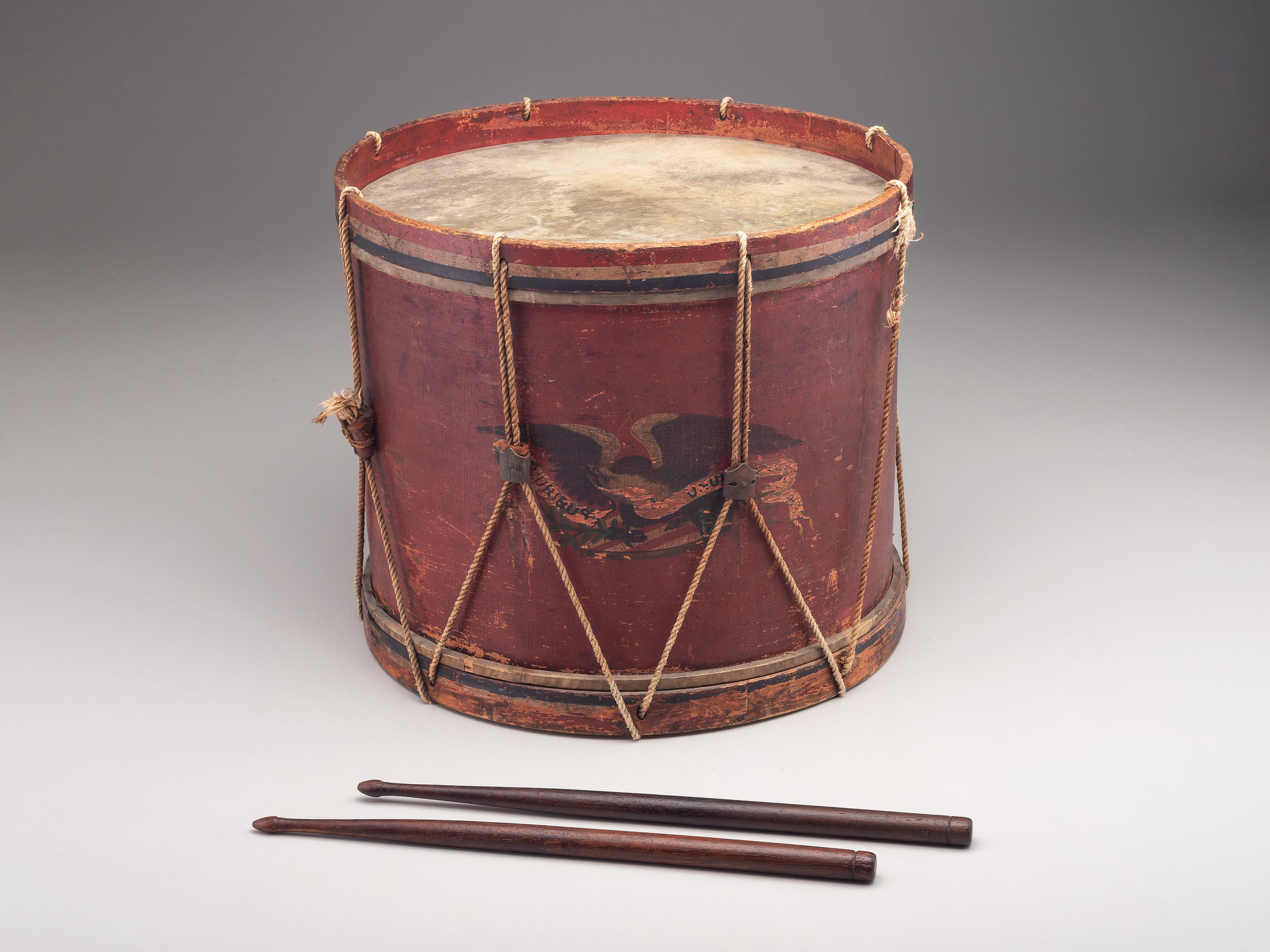 [CIVIL WAR]. E Pluribus Unum red-painted drum featuring eagle motif, with drumsticks.
