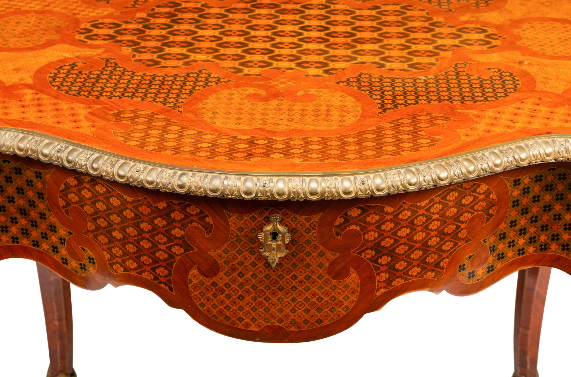 A Napoleon III Style Gilt Bronze Mounted Marquetry Center Table